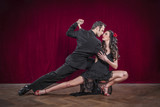 Portrait of young elegant tango dancers.