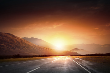 Sunset above road