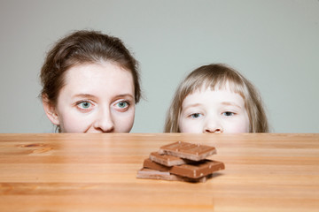 Young woman wanting to eat milk chocolate