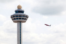 Singapore Changi Airport Traffic Controller Tower With Plane Tak