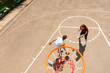 © kolotype - Couple Playing Basketball on Outdoor Court