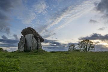 Wall Mural - trethevy quoit, cornwall, uk at sunset with blue sky and clouds