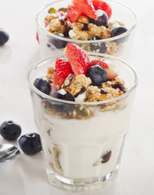 Granola With Yogurt And Fresh Berries In  Glass.