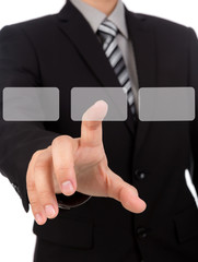 Business man touching an imaginary screen against white backgrou