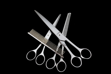 Three different kinds of  scissors and comb isolated