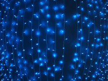 Defocused And Blur Image Of Garland Of Blue LED Lights