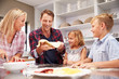© Monkey Business - Family making pizza together