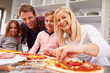 © Monkey Business - Family making pizza together