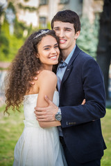 Wall Mural - Portrait of happy wedding couple outdoors