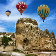 © Travel Faery - Show of hot air balloons flying over Cappadocia, Goreme, Turkey,