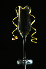 Glass of champagne on a black background