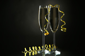 Glasses of champagne on a black background