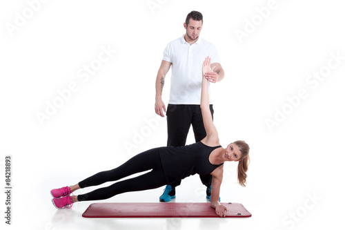 Fotografía Personal Trainer macht Sport Übung mit Frau