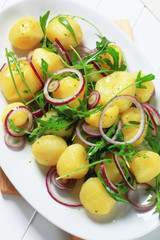 Canvas Print - Potatoes with arugula and onion