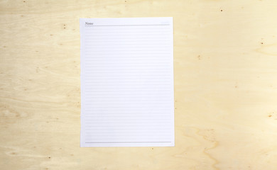 Wall Mural - Blank white note sheet on wood background