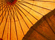 Old fabric orange umbrella structure background