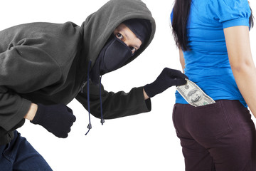 Wall Mural - Pickpocket in action to take money