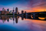 Fototapeta  - Sunset over the Minneapolis skyline and Mississippi River, in Mi