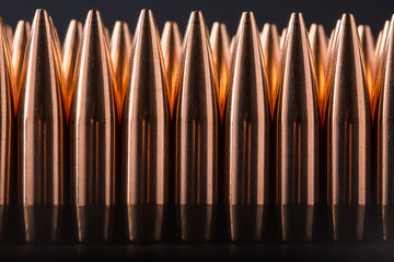 Macro shot of copper bullets that are in many row