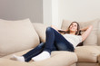 © Minerva Studio - Woman relaxing on her couch
