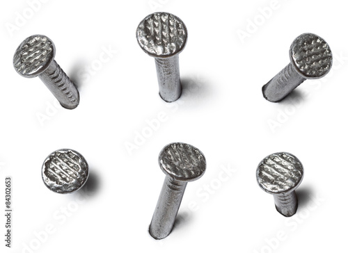 Fotomural set of metal nail head isolated on white background