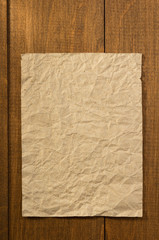 Wall Mural - wrinkled note paper on wood