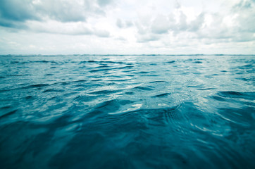 Wall Mural - selective focus on surface of sea and blue sky with clouds