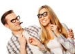 © Raisa Kanareva - lovely couple holding party glasses on stick