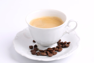 white mug of coffee beans isolated on white background ceramic china chicory