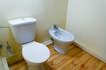 white porcelain bidet and toilet wc.