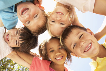 group of children looking down into camera