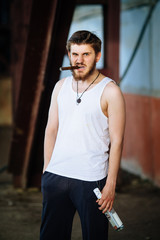 caucasian man smoking a cigar, looking at camera