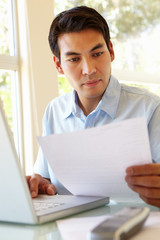 Filipino man working at home