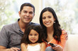 Hispanic family watching television