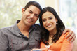 © Monkey Business - Hispanic couple at home