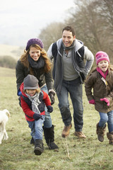 Wall Mural - Family having fun in the country in winter