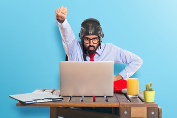 businessman in his office with pilot hat