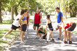 © Monkey Business - Group Of Runners Warming Up In Park