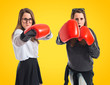 Twin sisters with boxing gloves