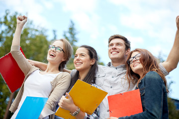 Poster - group of happy students showing triumph gesture