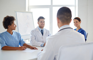 Wall Mural - group of happy doctors meeting at hospital office