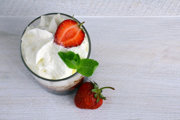 Poster - Healthy layered  desserts with fresh strawberries and cream on wooden 