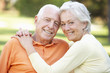 © Monkey Business - Head And Shoulders Portrait Of Romantic Senior Couple In Park