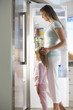 © Monkey Business - Mother And Daughter Choosing Snack From Fridge