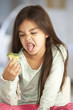 © Monkey Business - Unhappy Young Girl Rejecting Plate Of Fresh Vegetables