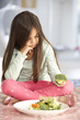 © Monkey Business - Unhappy Young Girl Rejecting Plate Of Fresh Vegetables