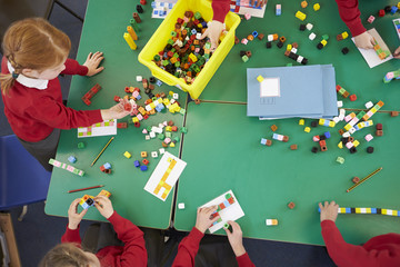 Overhead View Of Pupils Working With Coloured Blocks
