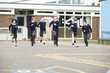 © Monkey Business - Group Of Elementary School Pupils Running In Playground