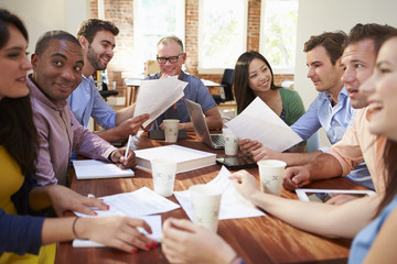 Wall Mural - Group Of Office Workers Meeting To Discuss Ideas