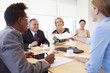 © Monkey Business - Five Businesspeople Having Meeting In Boardroom